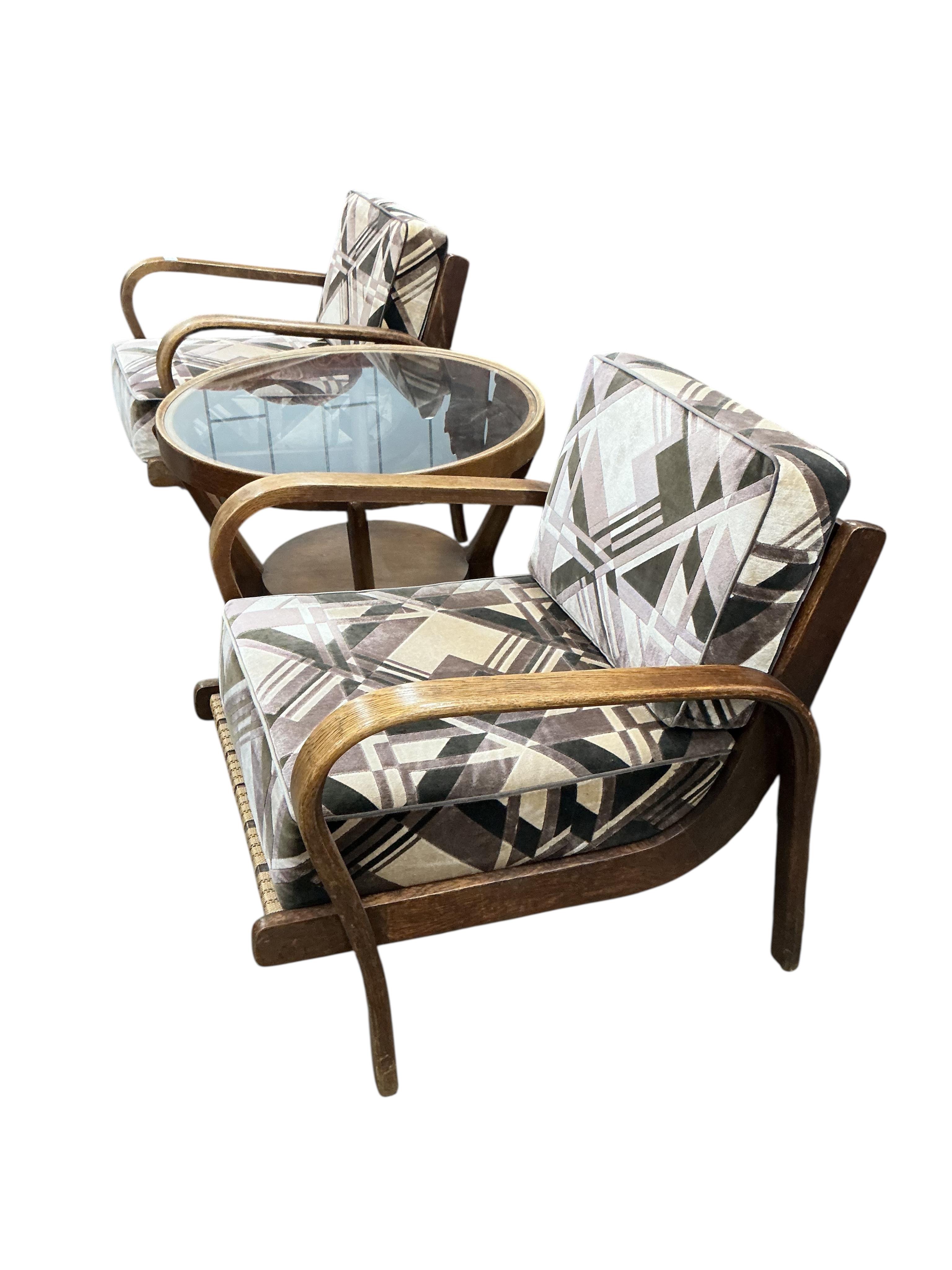 A 1930’s Czech bentwood suite comprising a pair of armchairs and circular low table, diameter 74cm, height 56cm.